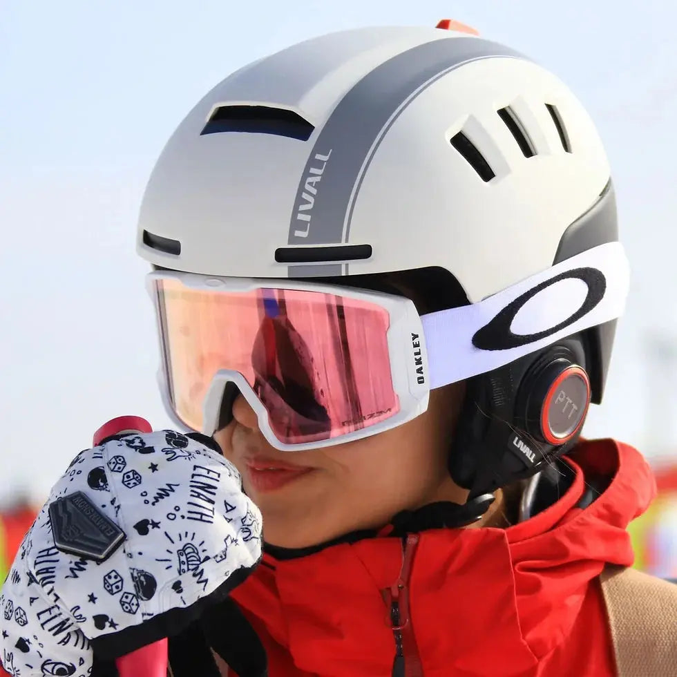 LIVALL RS1 smart ski helmet with integrated Bluetooth speakers, PTT walkie-talkie, built-in denoising microphone, live location sharing, fall detection, and impact protection for a safer and more connected skiing experience.