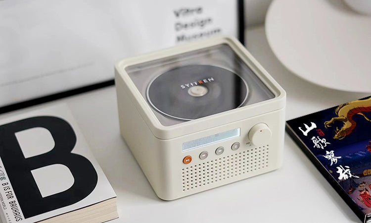 The SYITREN R200 Portable Retro CD Player Bluetooth Speaker plays mini and regular CDs, has anti-skip protection, multiple playback modes, a headphone jack, and an LCD display. Compact and lightweight for on-the-go use.