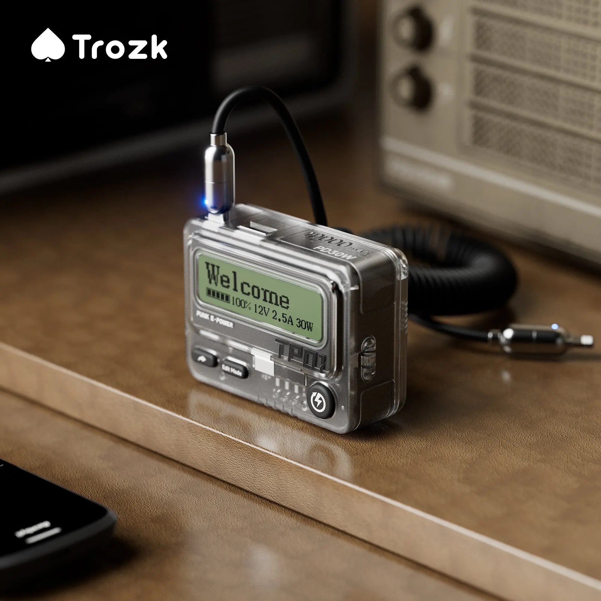 Trozk 10000mAh power bank styled like a vintage beeper, complete with a digital display screen. Offers PD 30W fast charging and unique messaging capabilities to communicate with other Trozk power banks.